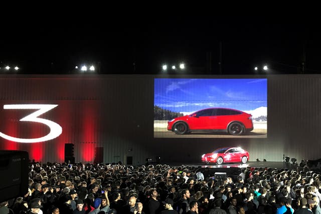 Tesla introduces one of the first Model 3 cars off the Fremont factory's production line during an event at the company's facilities in Fremont, California