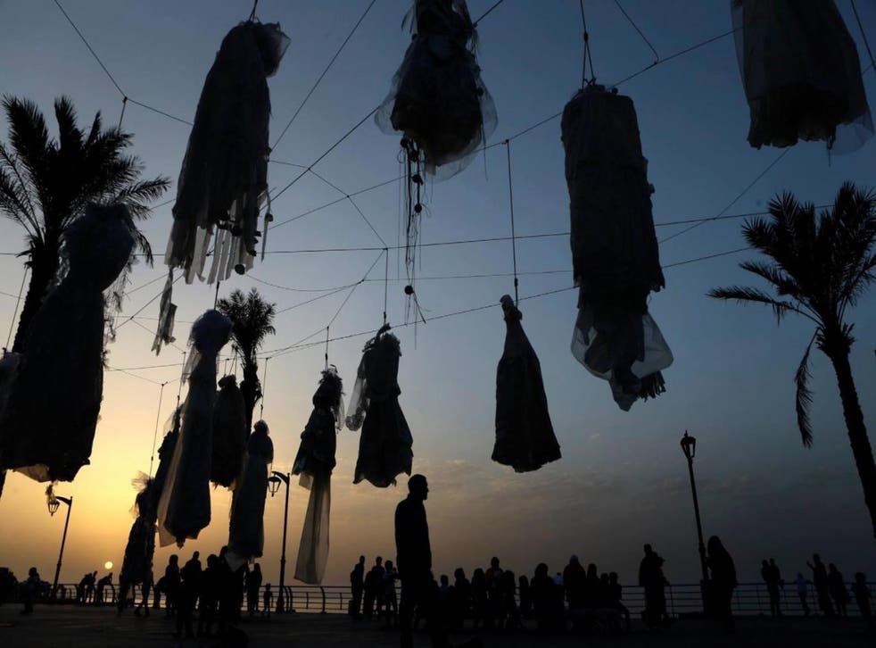 Wedding dresses were strung up along Beirut's Corniche in April in a protest targeting a similar article in the Lebanese penal code (Abaad)