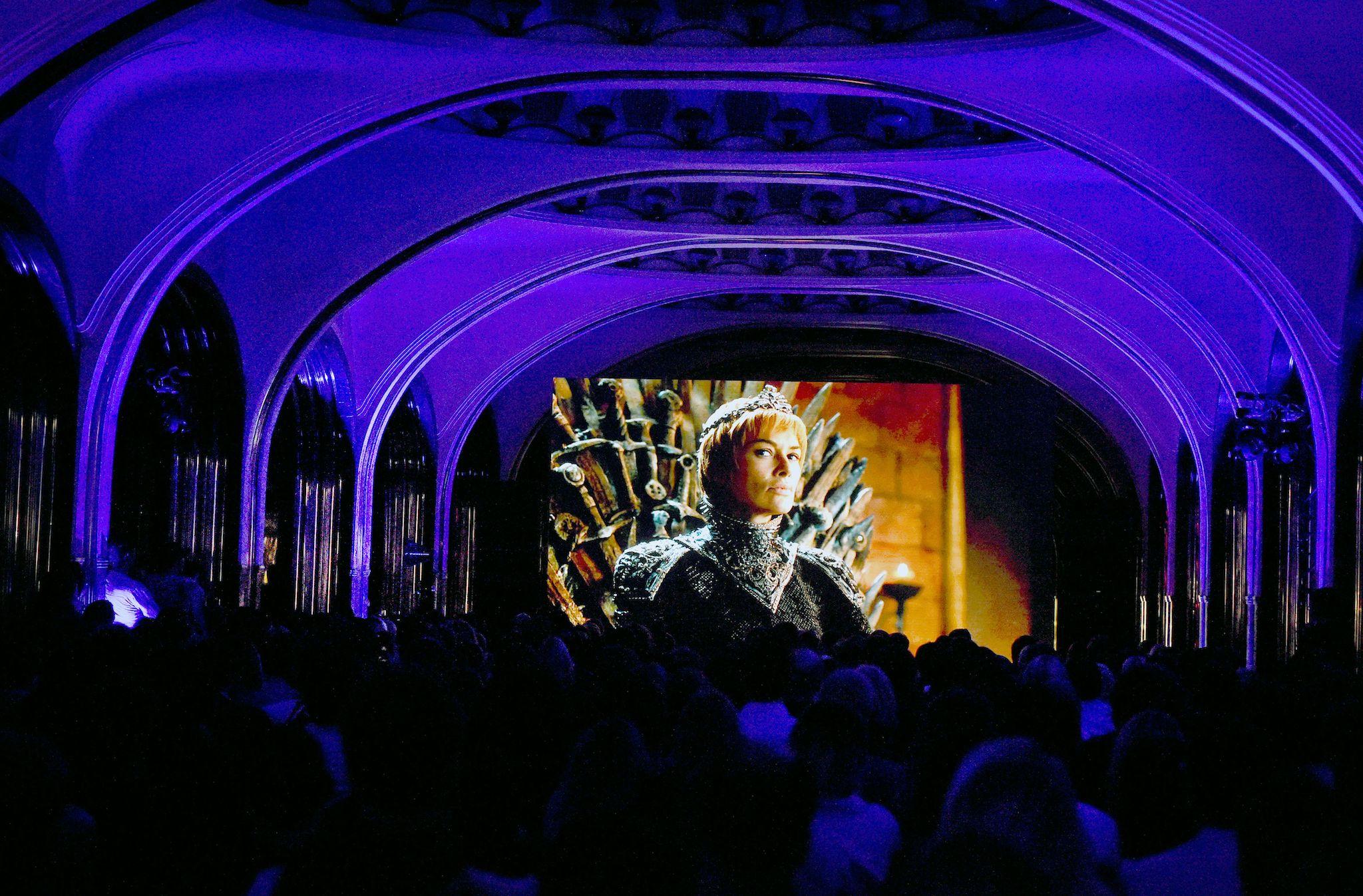 People watch the seventh season premiere of US TV show "Game of Thrones" at the Mayakovskaya metro station in Moscow early on July 18, 2017