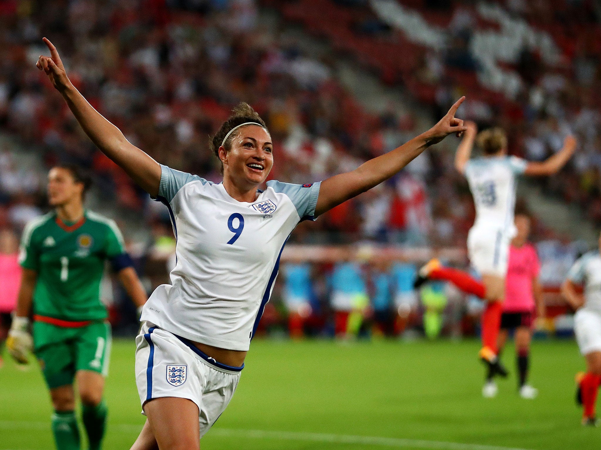 Jodie Taylor celebrates after scoring her hat-trick against Scotland