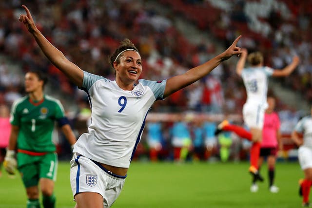 Jodie Taylor celebrates after scoring her hat-trick against Scotland