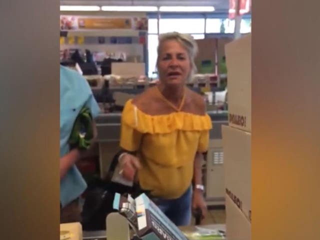 The woman was caught on camera shouting at the couple, telling them they were 'disgusting'