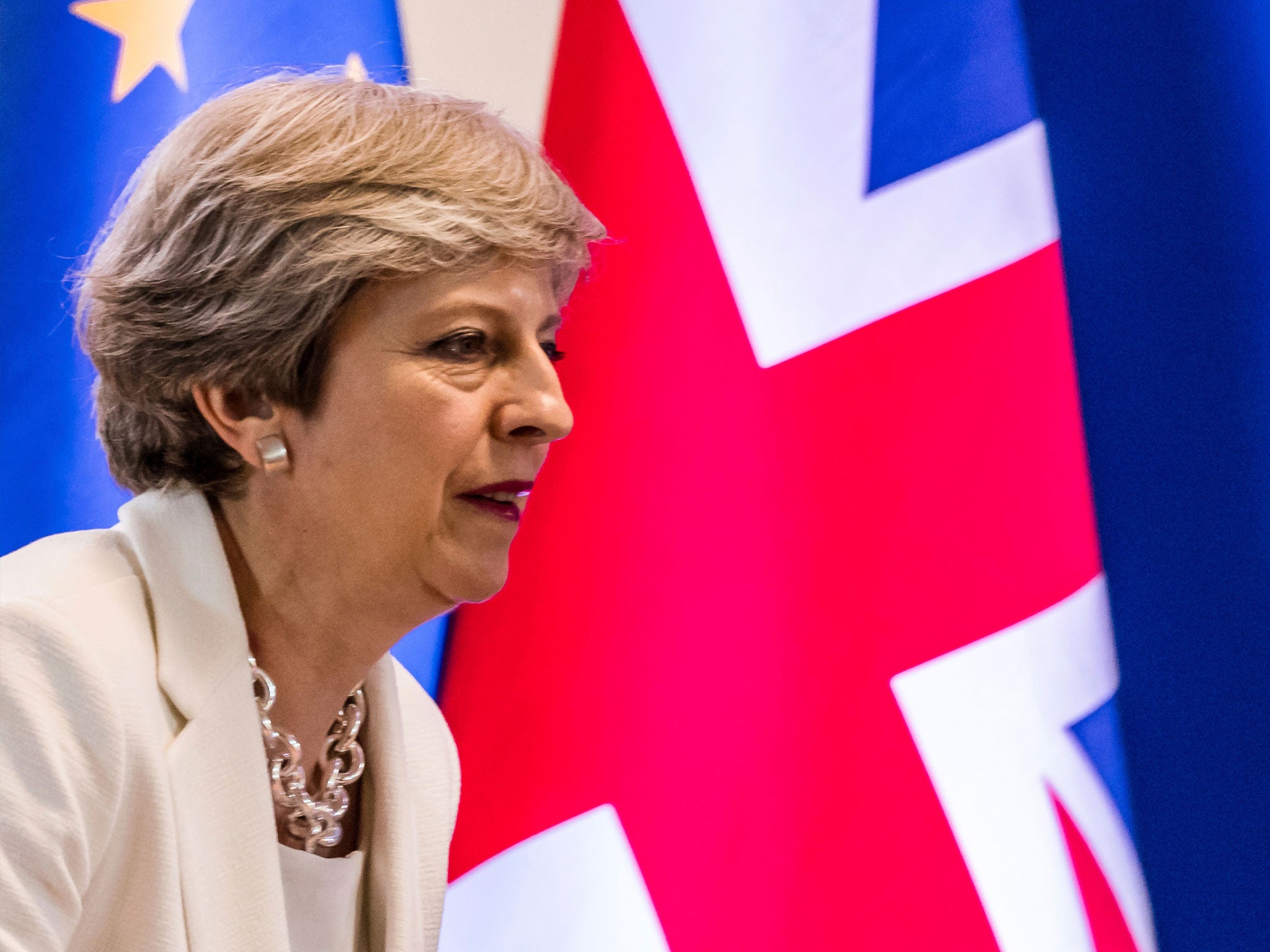 Theresa May insists Britain will leave the EEA automatically when it leaves the EU