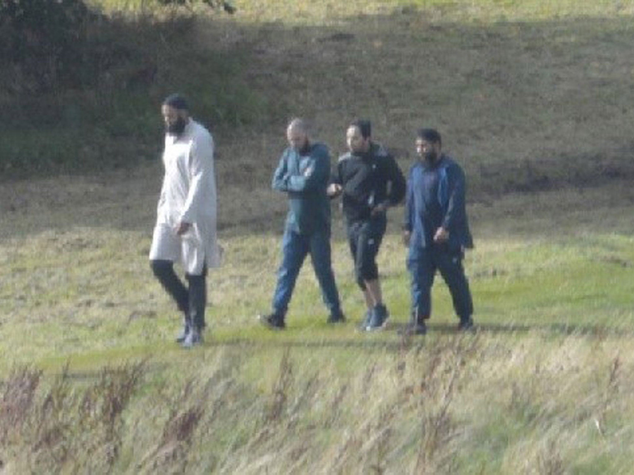 &#13;
Naweed Ali, Tahir Aziz, Mohibur Rahman and Khobaib Hussain in the park at Bank Hall Road in Stoke on 21 August 2016, five days before their arrests &#13;