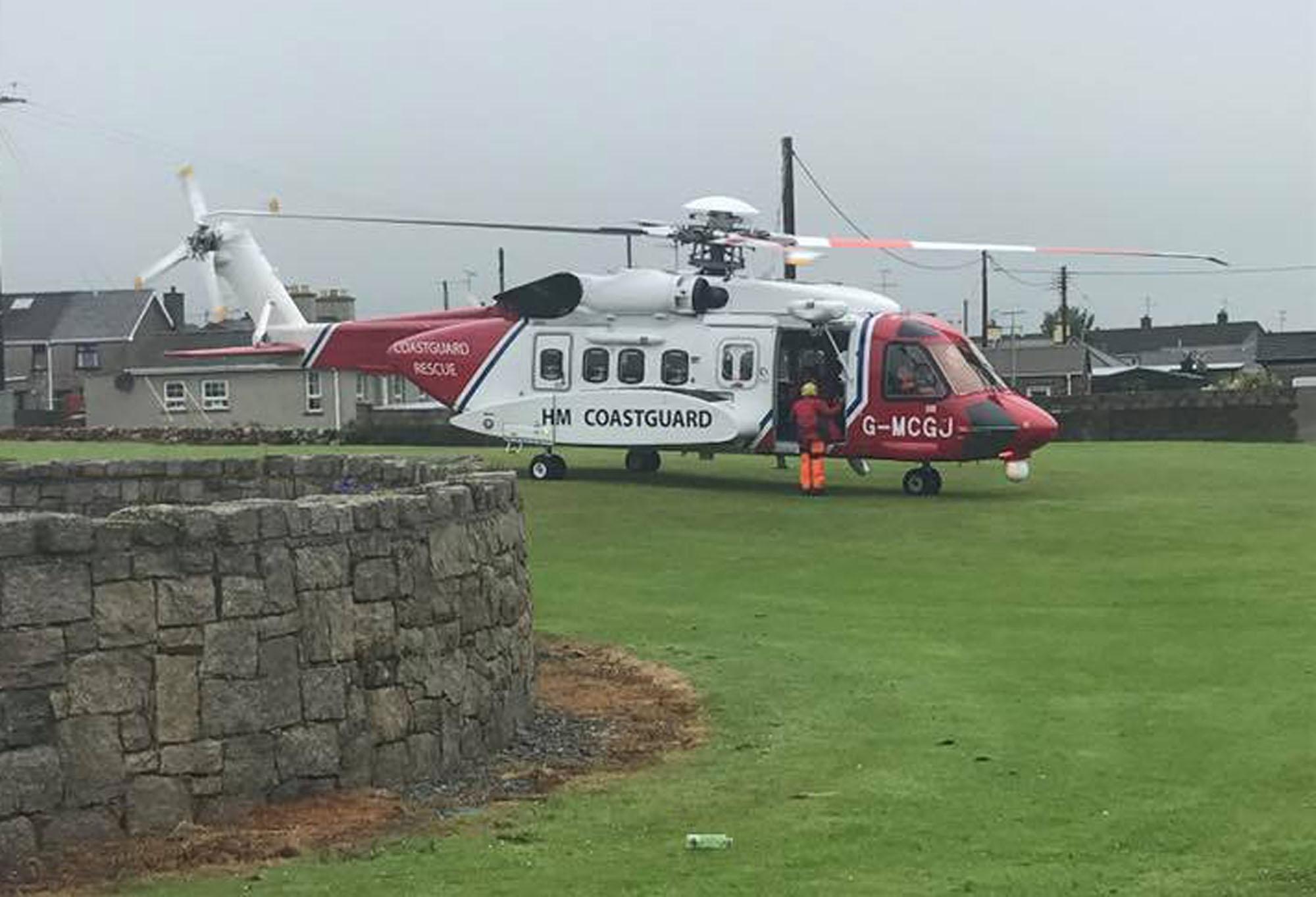 An HM Coastguard rescue helicopter landing in Annalong, County Down