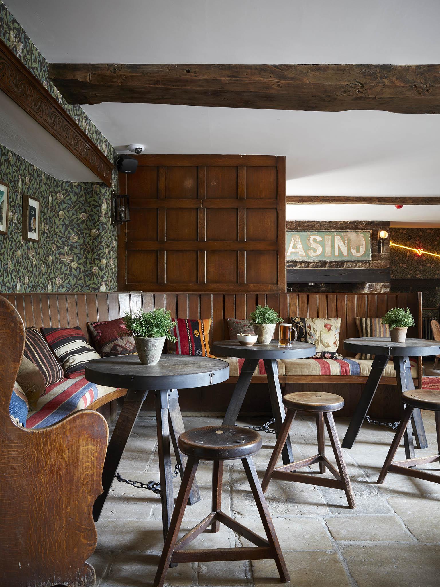 Inside in the pub it’s a mix of flagstone flooring and heavy, old wooden seating