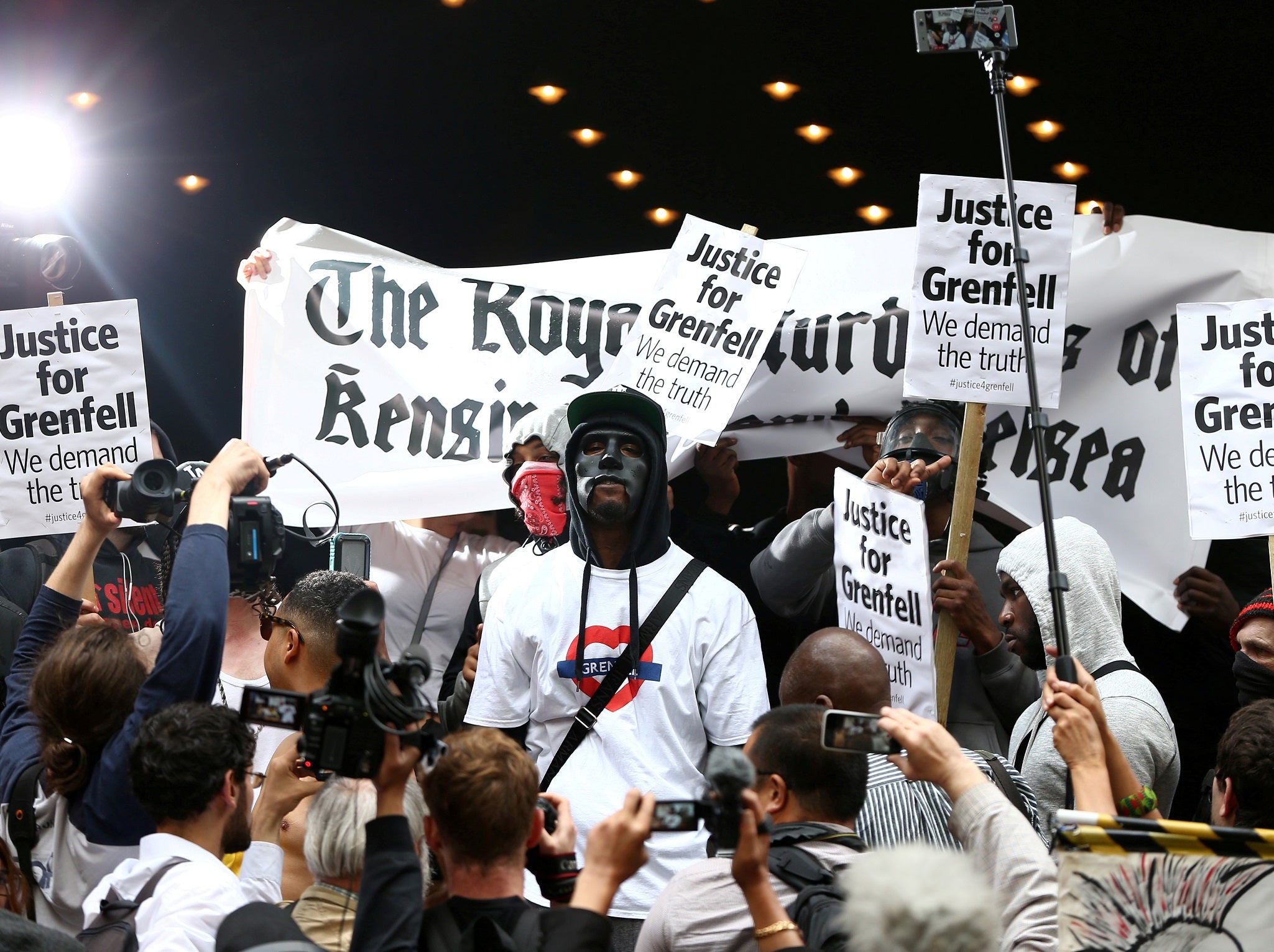 Demonstrators protest against the Grenfell Tower fire outside a Kensington and Chelsea Council meeting