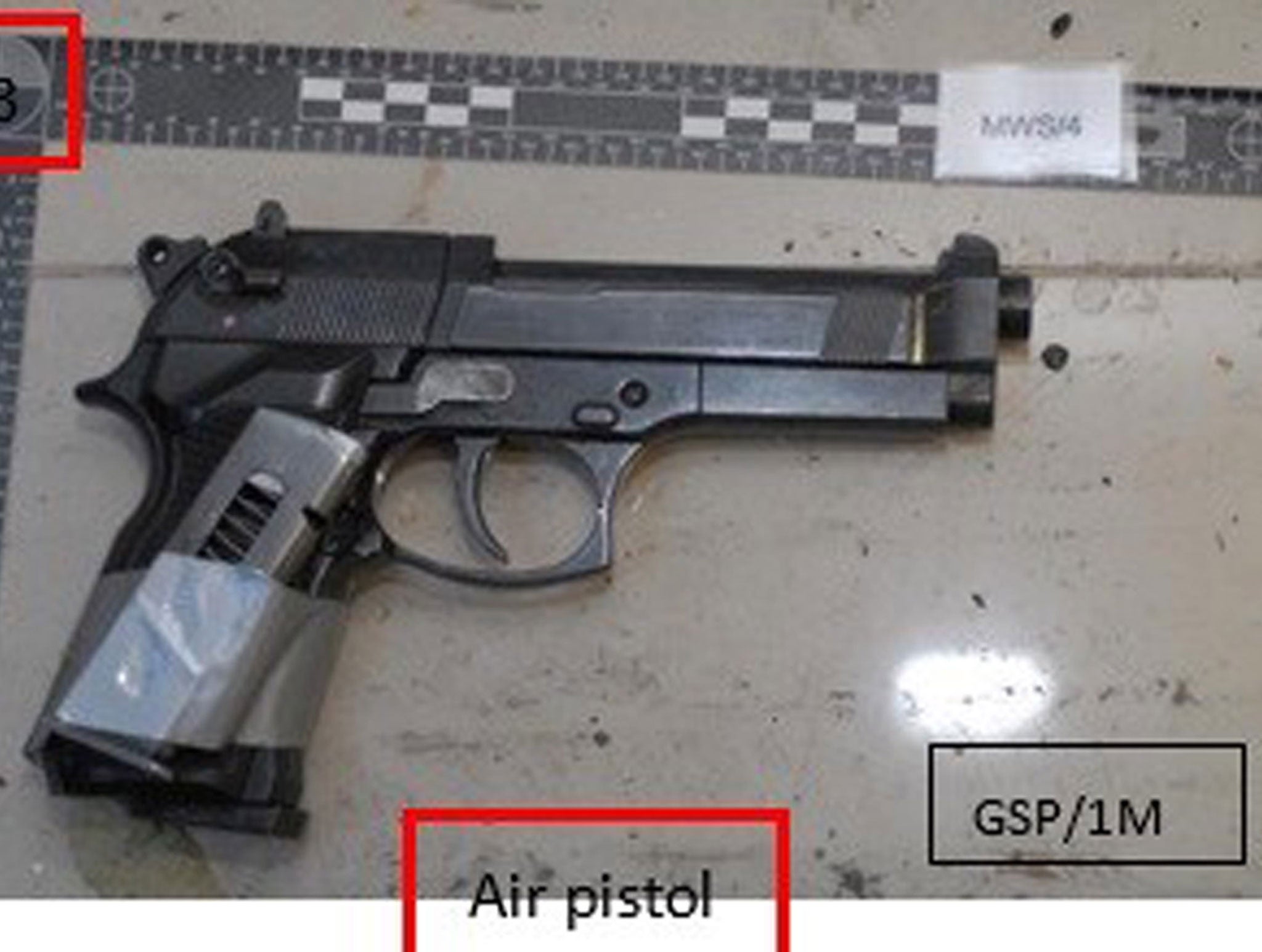 An imitation handgun with an empty magazine strapped to it that was found stashed in Naweed Ali's Seat Leon car