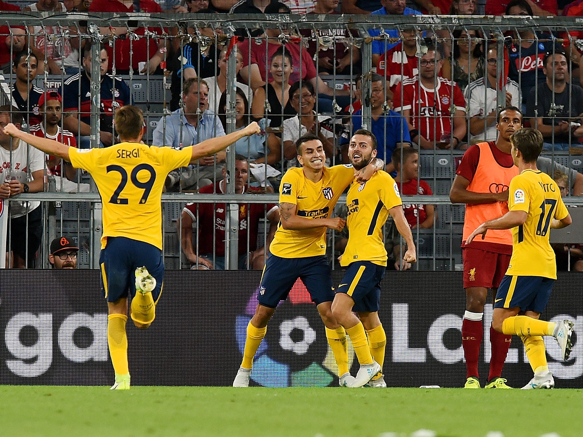 Atletico's players celebrate Bare's goal