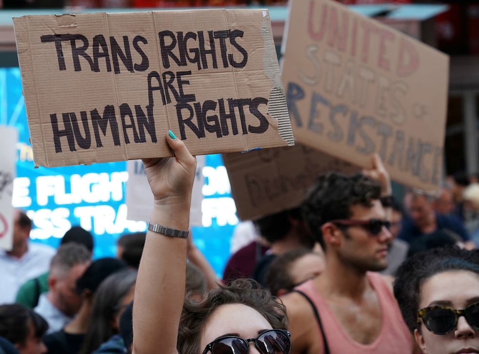 Demonstrators protest President Donald Trump's announcement on Twitter that he would ban transgender people from serving in the military 'in any capacity.'