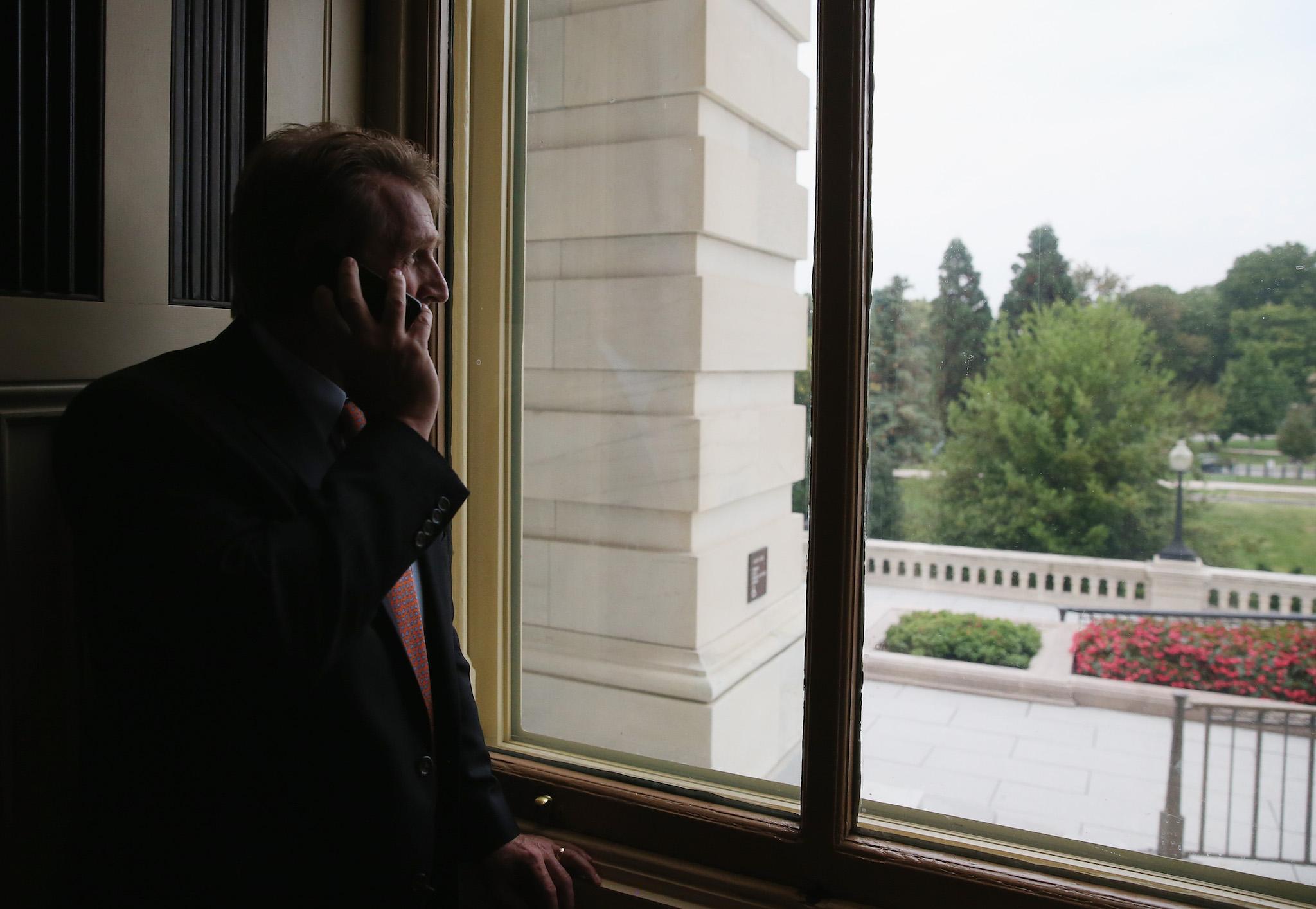 Jeff Flake looks out window in Capitol building in Washington, DC