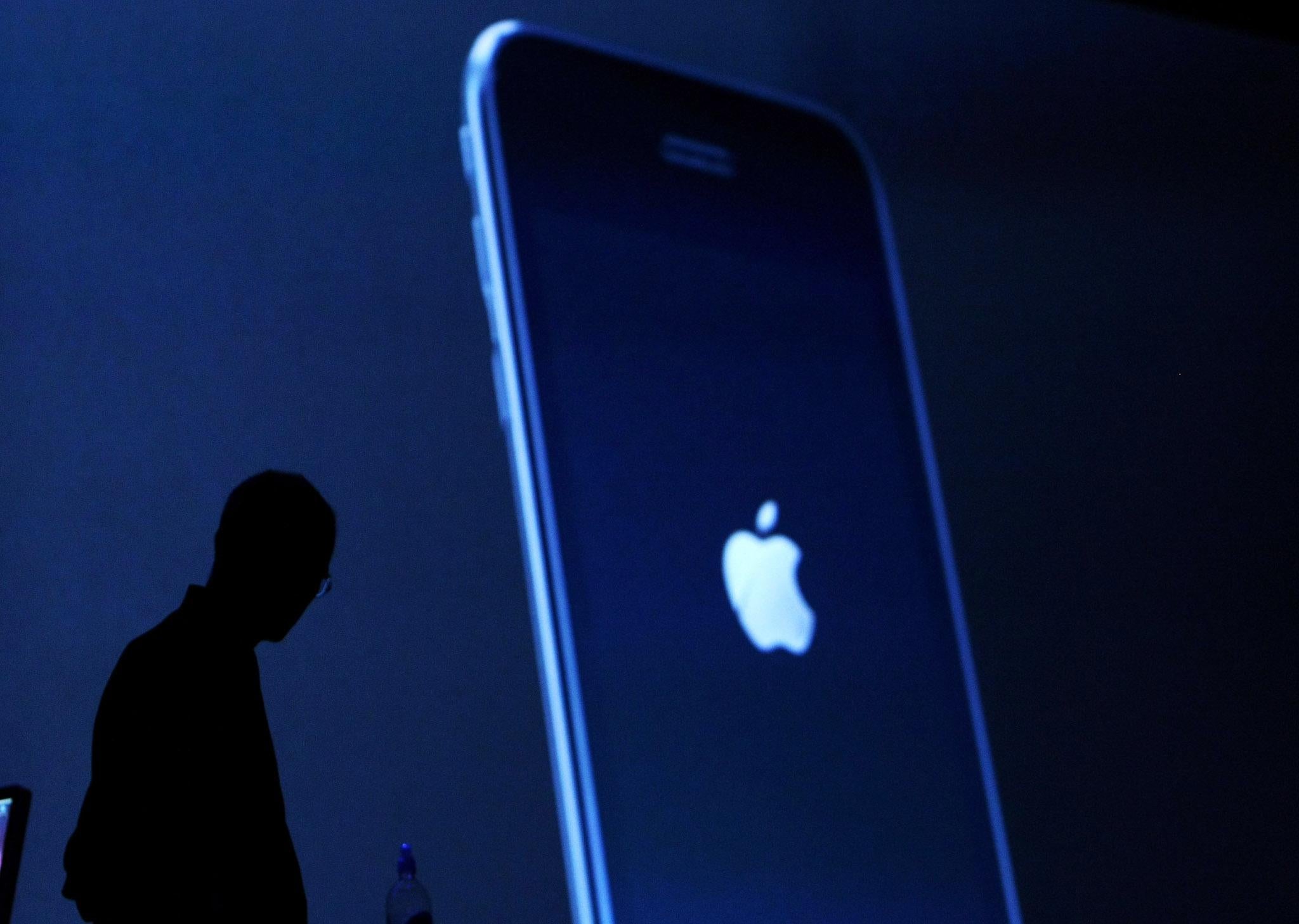 Apple CEO Steve Jobs watches a video of the new iPhone 3G as he delivers the keynote address at the Apple Worldwide Web Developers Conference June 9, 2008 in San Francisco, California