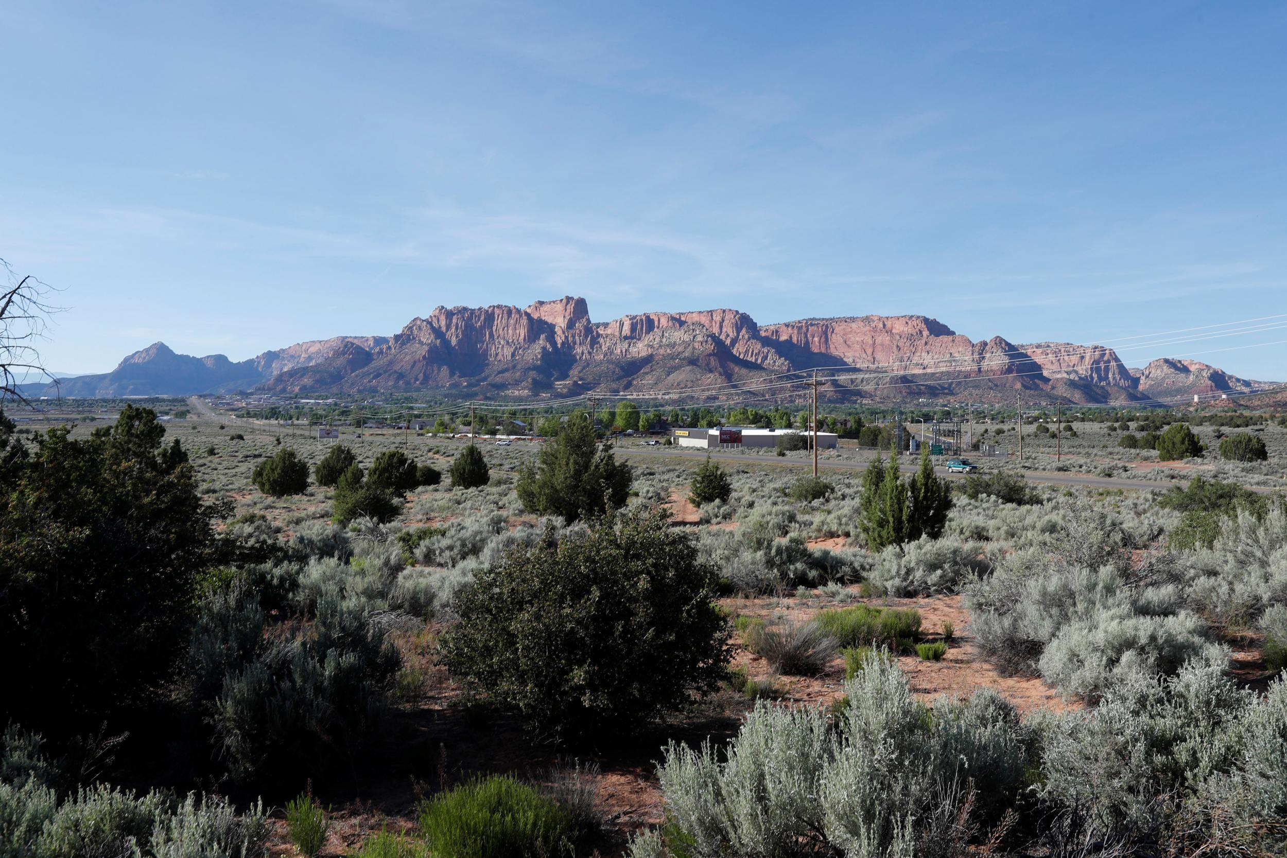 Red rock cliffs rise above Colorado City, Arizona and Hildale, Utah, where the Fundamentalist Church of Jesus Christ of Latter-Day Saints prophet leader Warren Jeffs lived
