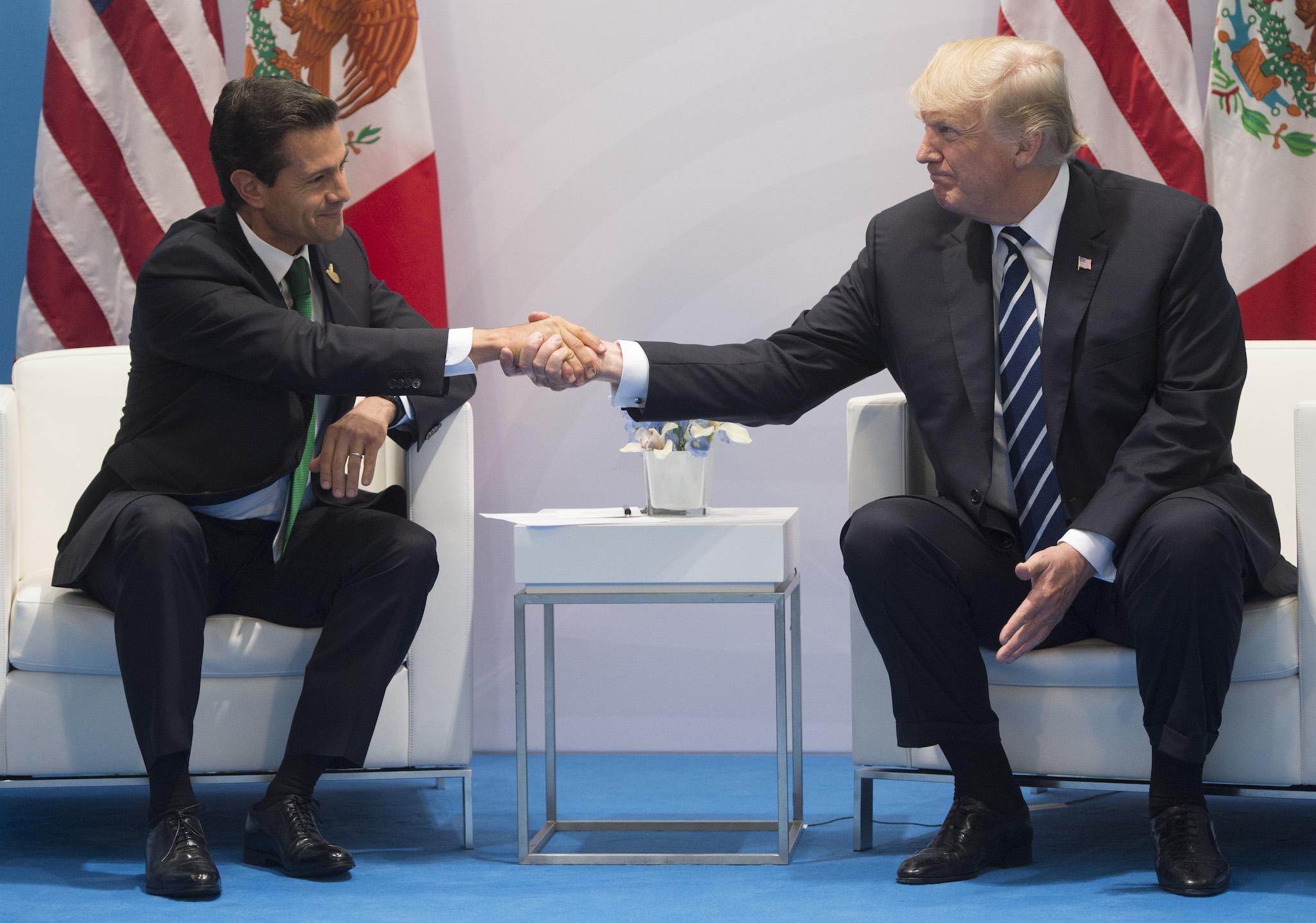 US President Donald Trump and Mexican President Enrique Pena Nieto shake hands during a meeting on the sidelines of the G20 Summit in Hamburg, Germany