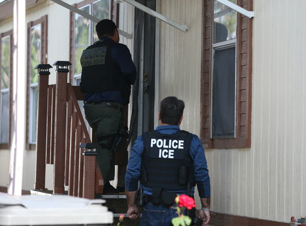 Federal Immigration and Customs Enforcement agents search for an immigrant in Santa Ana, California on May 11, 2017