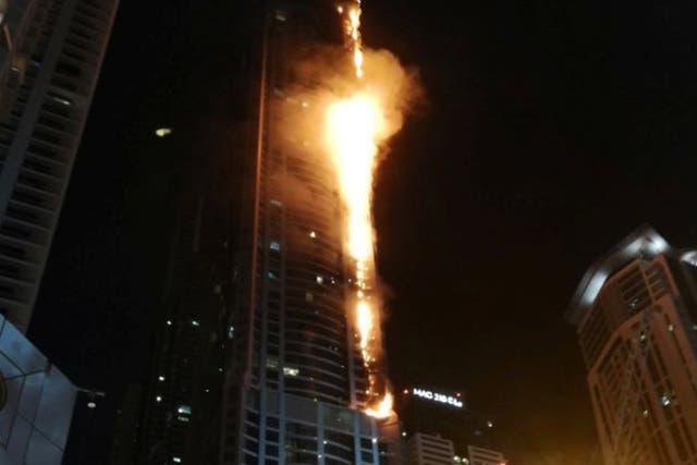 Flames shoot up the sides of the Torch Tower in the Marina district of Dubai