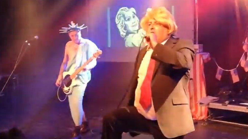 &#13;
Peter Bywaters dressed up as Trump at a 2016 gig in Germany &#13;
