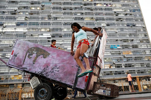 Silva makes a living from collecting recyclable materials. It has allowed her to move into a humble two-storey apartment in Sao Paulo with her boys