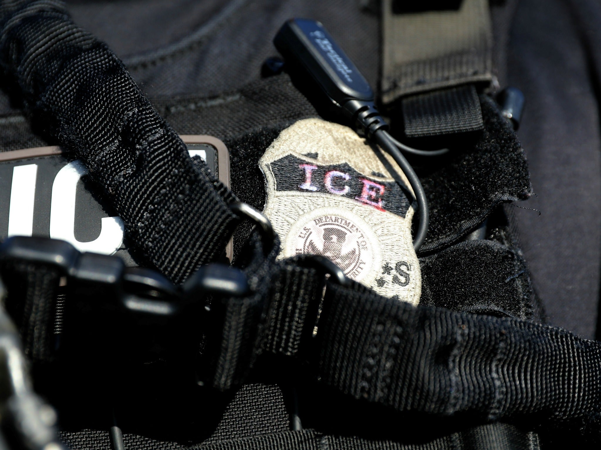The badge of a U.S. Immigration and Customs Enforcement agent, on an operation in Santa Ana, California.