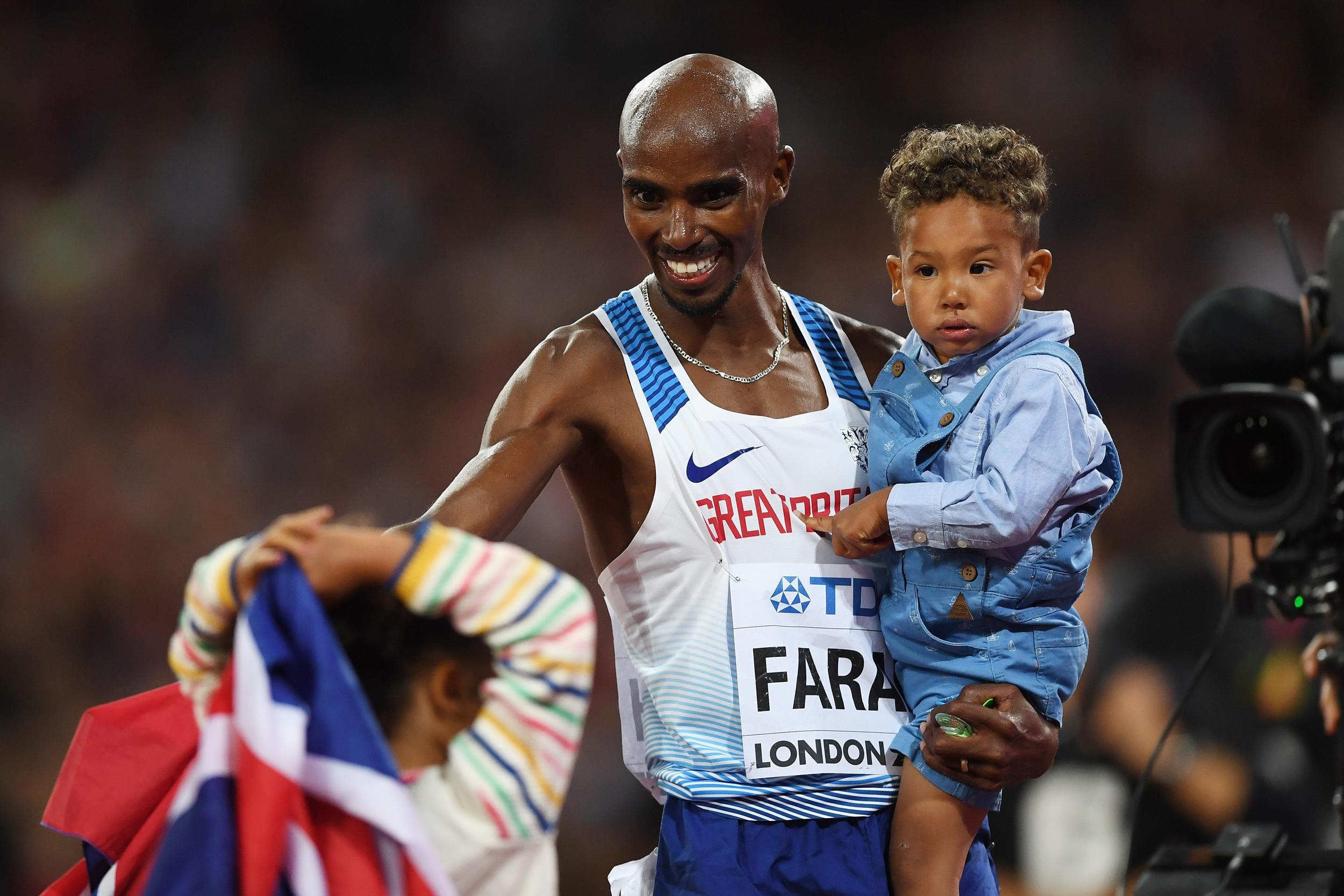 Farah celebrates his victory with his children