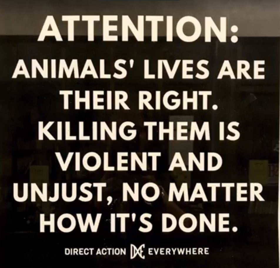 The sign reads: 'Attention: animals' lives are their right. Killing them is violent and unjust, no matter how it's done.'