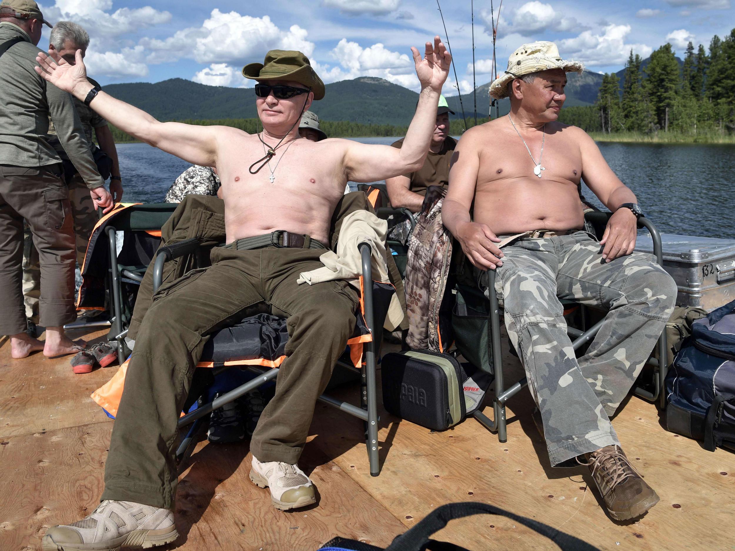 He was also pictured bare chested beside his defence minister Sergei Shoigu (Getty)