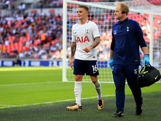 Kieran Trippier leaves the Wembley pitch to receive treatment