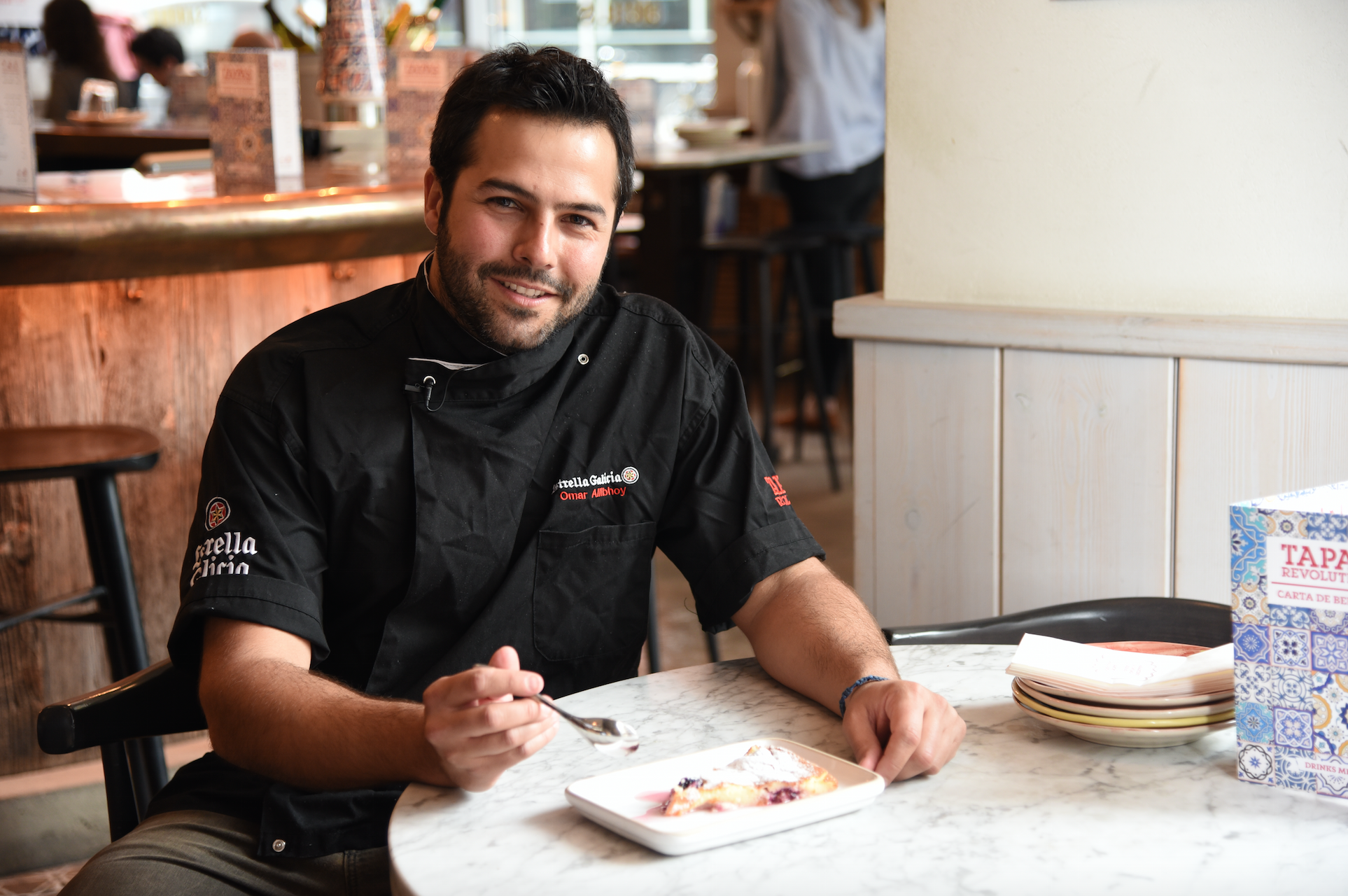 &#13;
Omar Allibhoy enjoying a slice of Tarta asada de queso fresco y moras &#13;