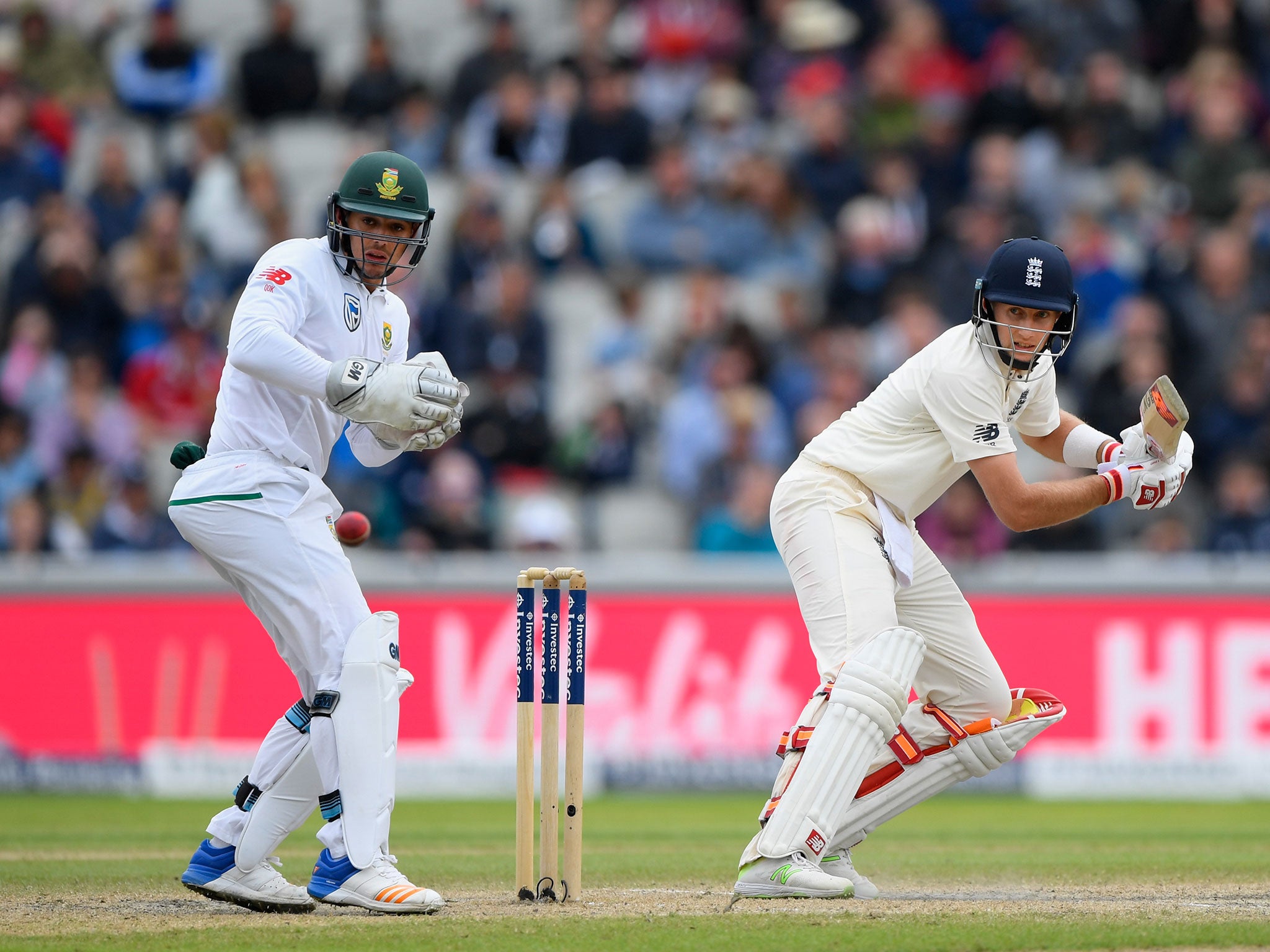 Joe Root fine cuts a ball towards the boundary for England