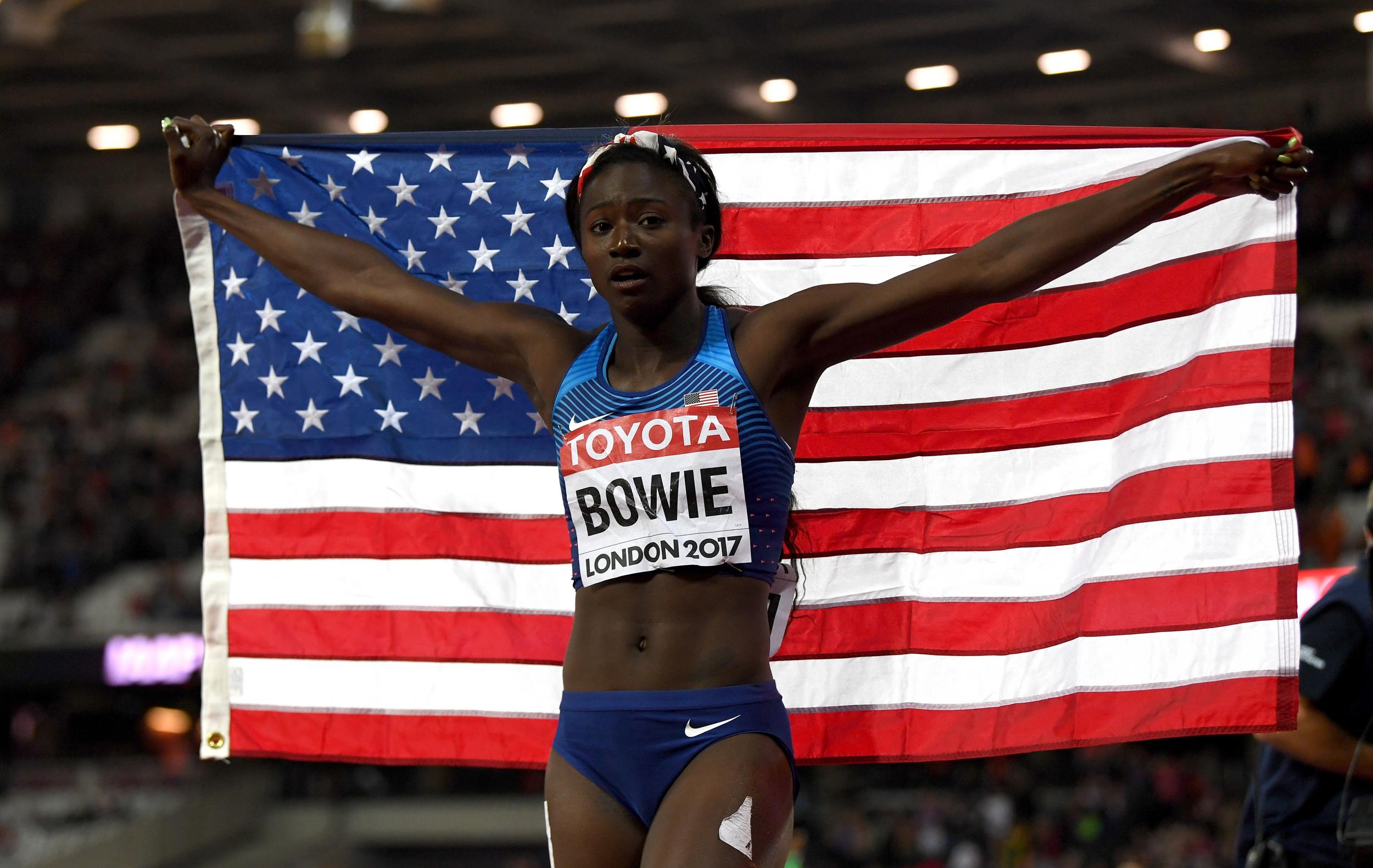 Tori Bowie edged out victory with a dipping finish