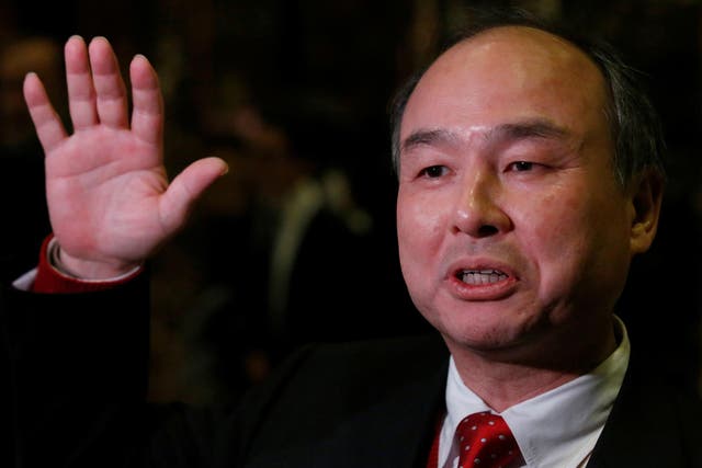 Masayoshi Son says he has his eyes on investing in Uber as well as its rival Lyft
