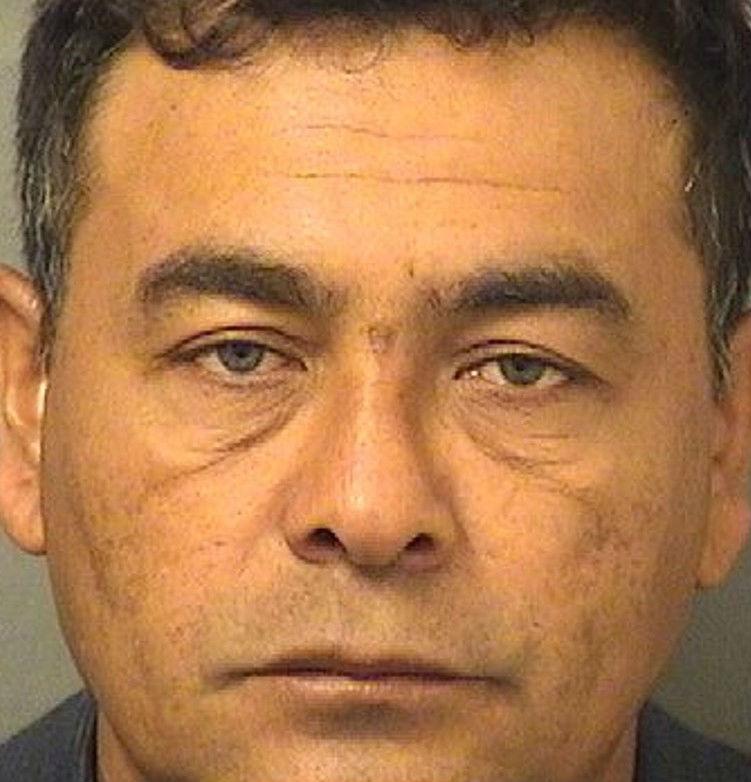 Mr Mena is being held on murder charges (Palm Beach County Sheriff's Department )