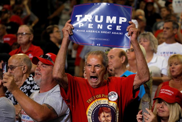 Donald Trump supporters listening to the President speak at a rally in Huntington, West Virginia, on 3 August 2017