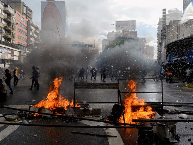 Opposition activists protesting against the newly inaugurated Constituent Assembly and riot police clash in Caracas, 4 August 2017