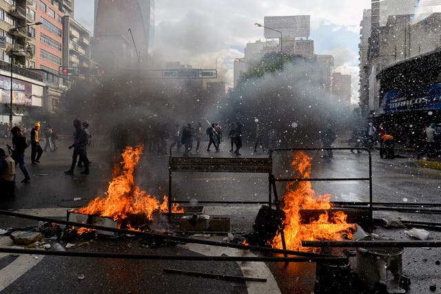 Opposition activists protesting against the newly inaugurated Constituent Assembly and riot police clash in Caracas, 4 August 2017
