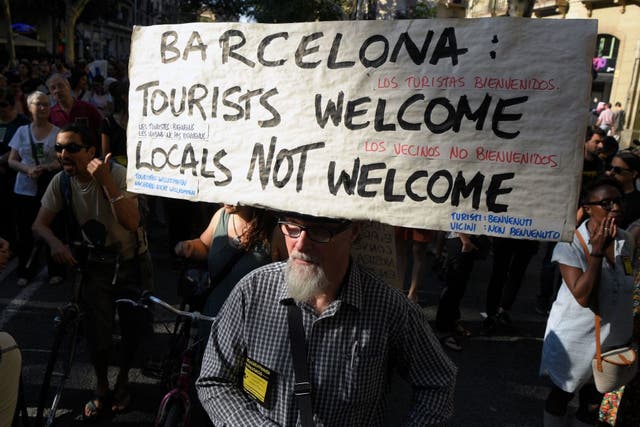 Protesters demonstrating against tourism in Barcelona in June