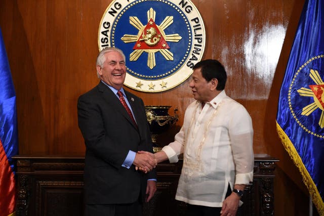 Philippine President Rodrigo Duterte shakes hands with US Secretary of State Rex Tillerson prior to their meeting at Malacanang Palace in Manila