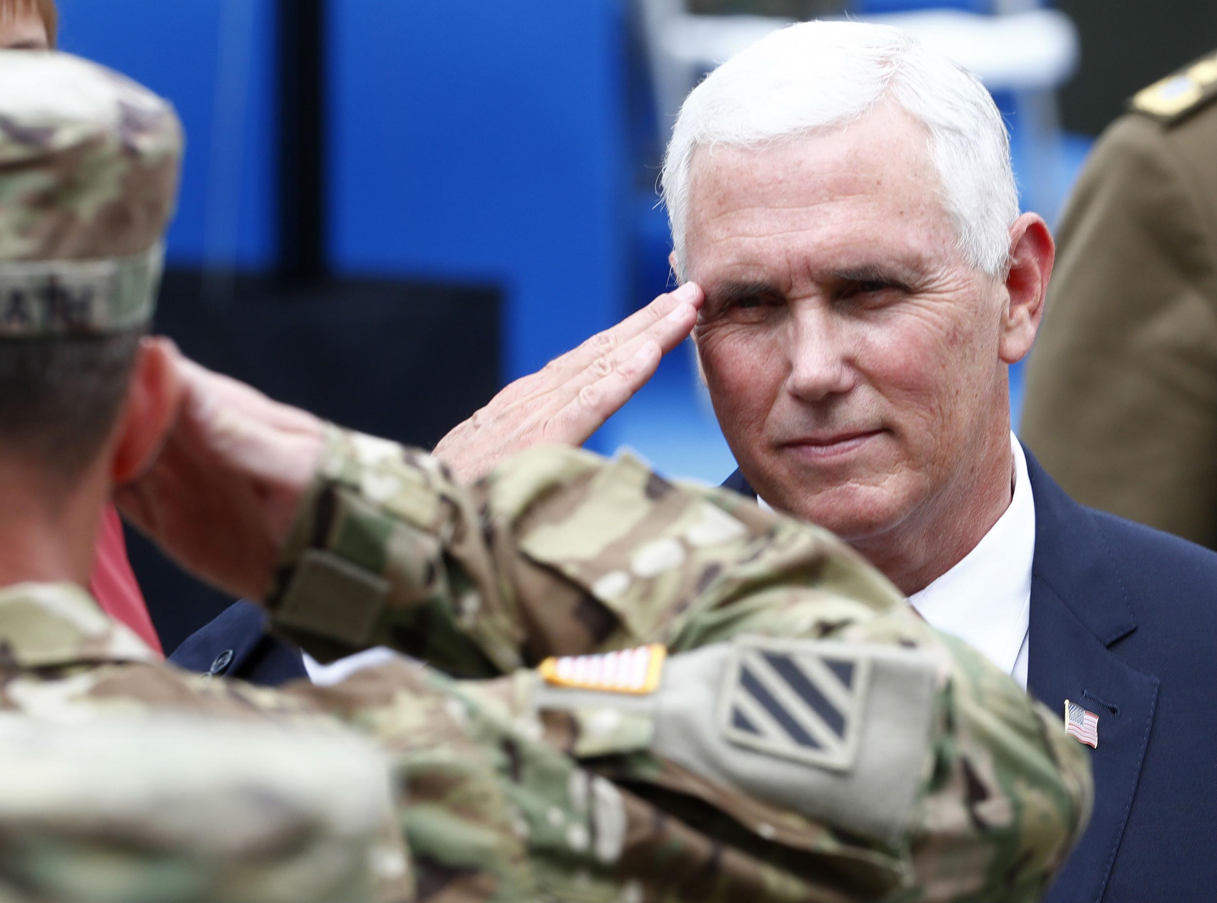 Mike Pence salutes soldiers as he visits NATO's Enhanced Forward Presence mission and Estonian troops in Tallinn, Estonia July 31, 2017