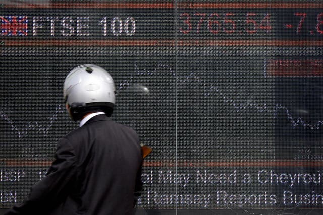 An electronic display board showing the FTSE 100 share index in London on 24 October 2008. Ten years on, the signs are pointing to some level of ‘correction’