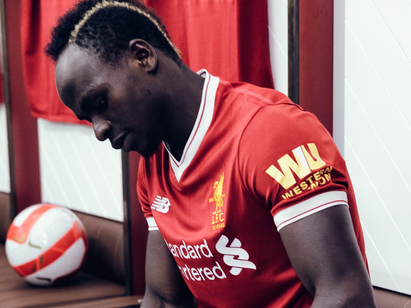 Sadio Mané wearing the Liverpool home kit with new sleeve sponsor