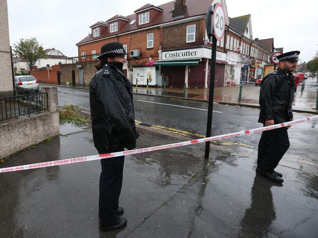 Police at the scene in Thornton Heath, south London, where a 15-year-old boy was stabbed to death last night