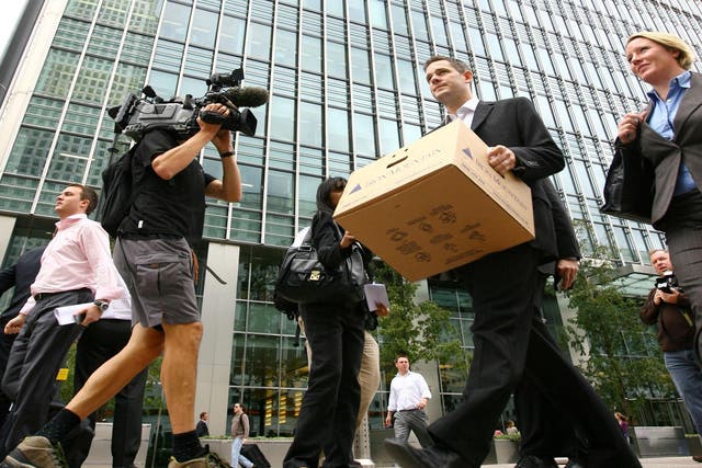 Bankers leave Lehman Brothers in Canary Wharf, London, after it went bust