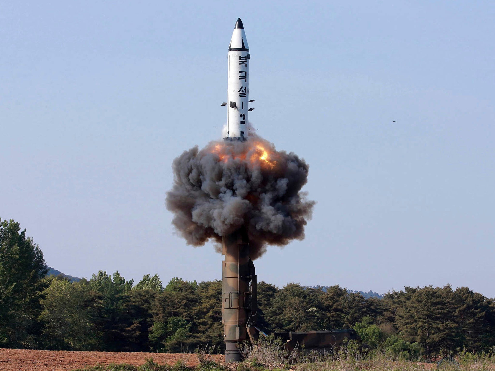 File photo distributed by the North Korean government in May 2017 shows a solid-fuel "Pukguksong-2" missile lifting off during a launch test at an undisclosed location