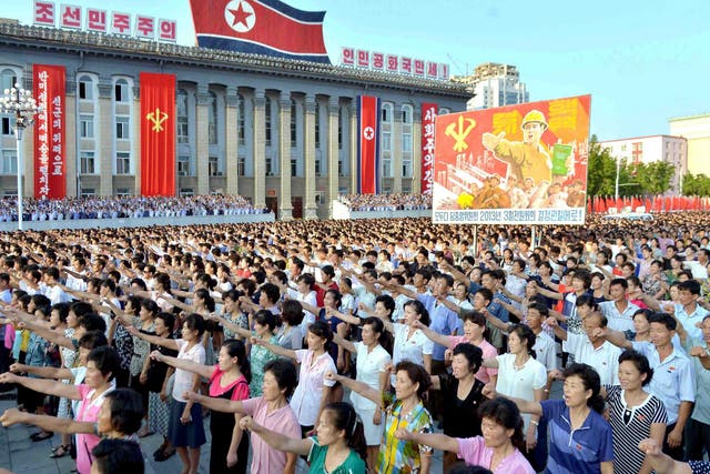 People participate in a mass rally in Pyongyang held at Kim Il-sung Square on 9 August 2017 to show support for Kim Jong-un's government