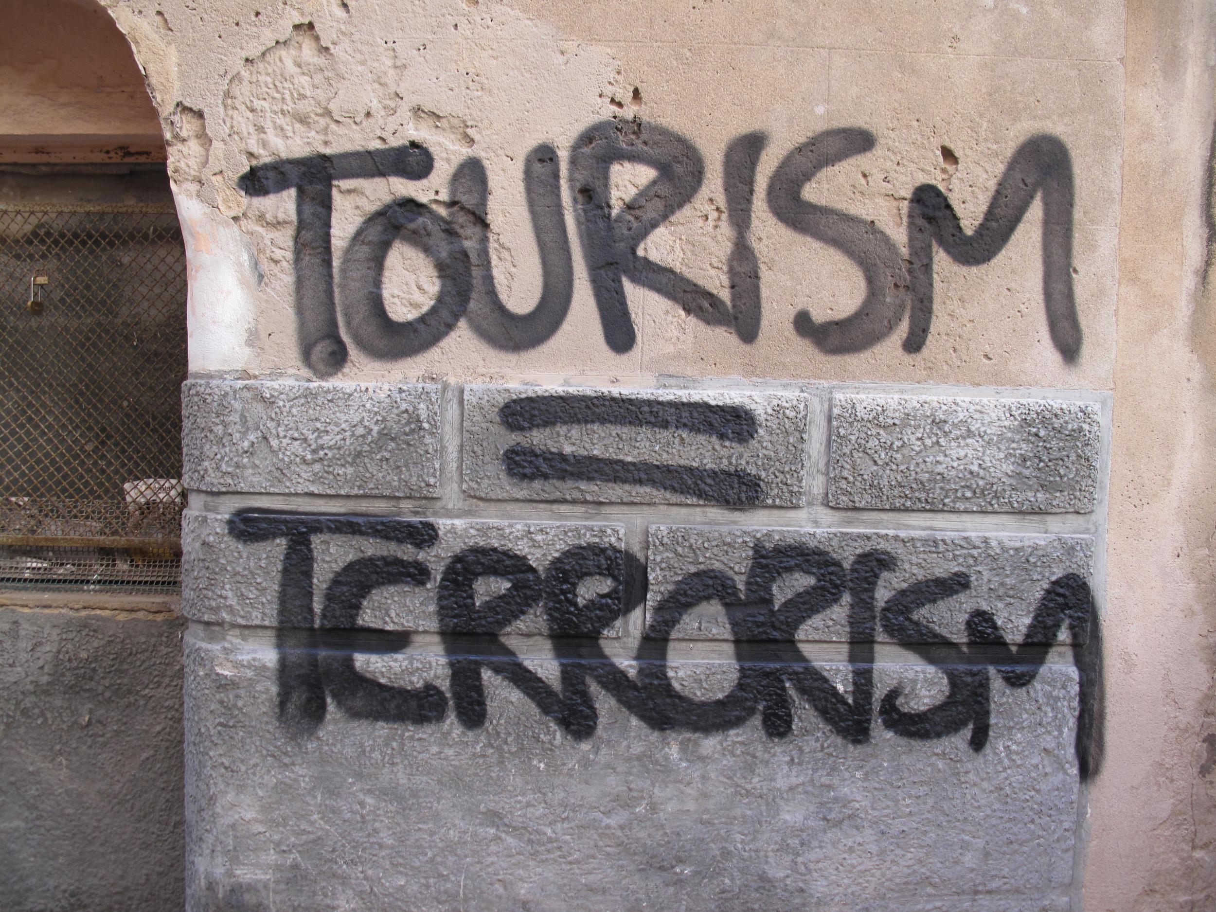 Good riddance? A slogan spray-painted on a wall in Palma de Mallorca