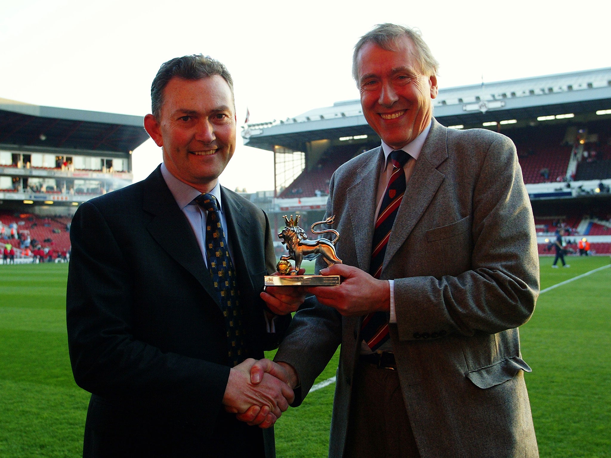 Tyler receives the award for Premiership Commentator of the Decade from Richard Scudamore in the early 2000s