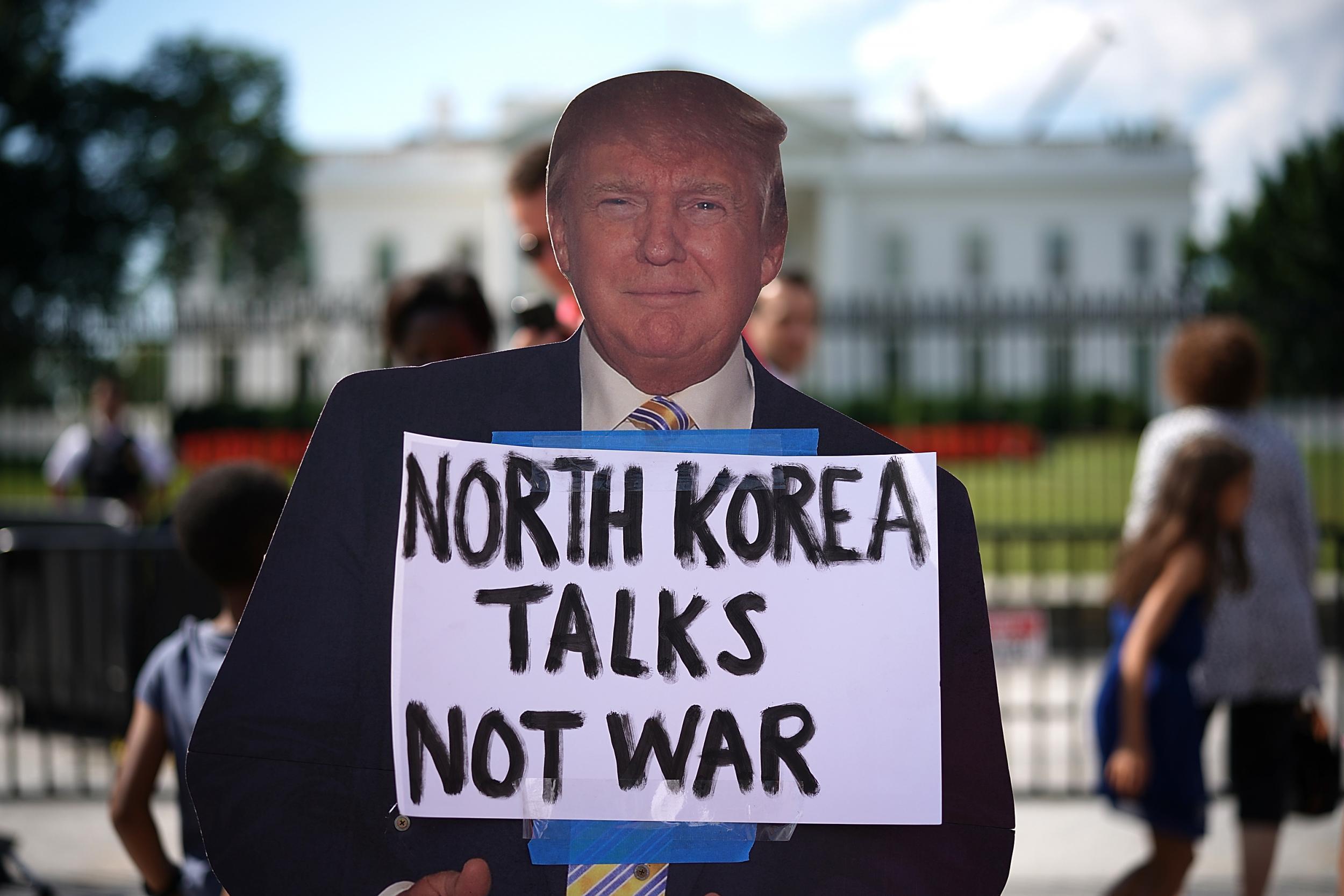 A cardboard cutout of US President Donald Trump is shown during a protest against escalating threats of military action in North Korea