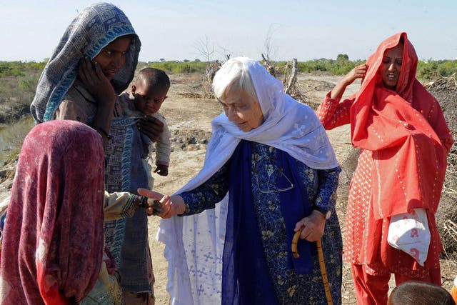 Ruth Pfau (C), head of a Pakistani charity fighting leprosy and blindness, meets people in flood-affected southern Pakistan in December 2010. She has died aged 87