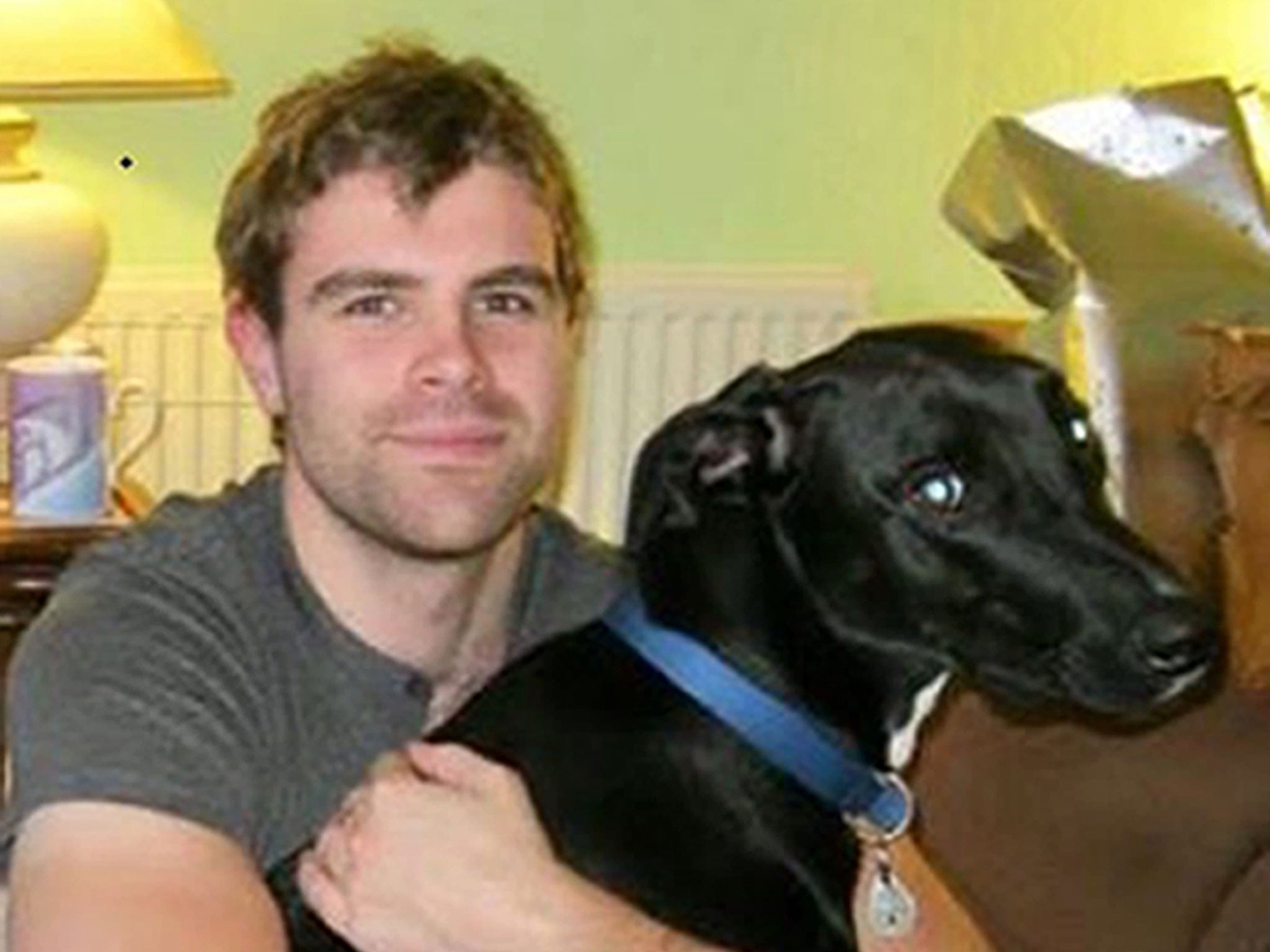 Cameron Logan with his dog, Gomez, who both perished in the blaze