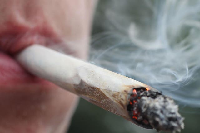 Man smoking a marijuana joint